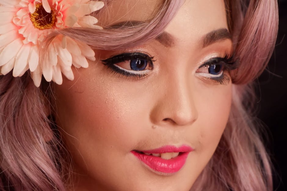Detailed close-up of an Asian woman with floral accessory, highlighting makeup and vibrant features.