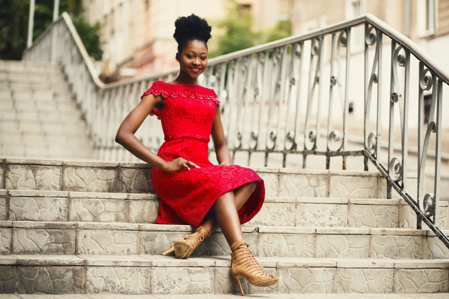 Woman wearing an elegant updo with a red dress