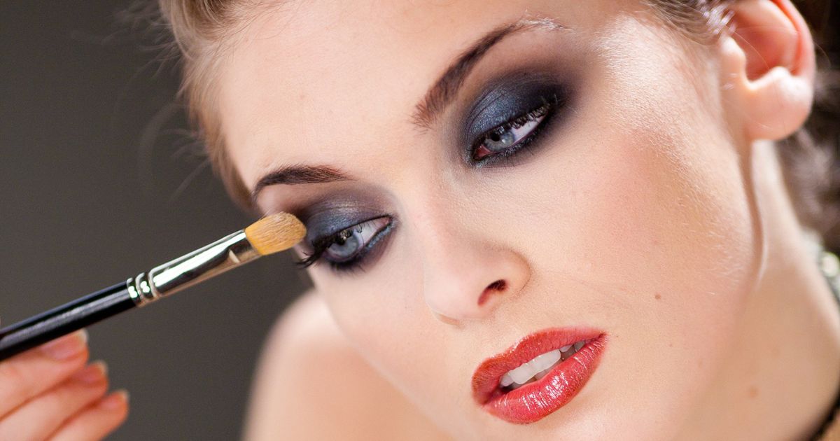 Close-up of eye makeup before styling statement earrings