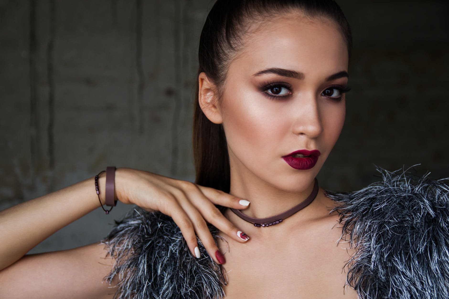 Young woman with dramatic makeup and styled hair